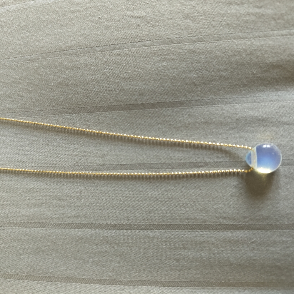 Elegant Gold Necklace with Opalescent Pendant